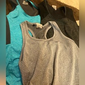 Three pack of second skin work out tank tops